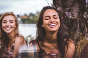 2 girls smiling and laughing