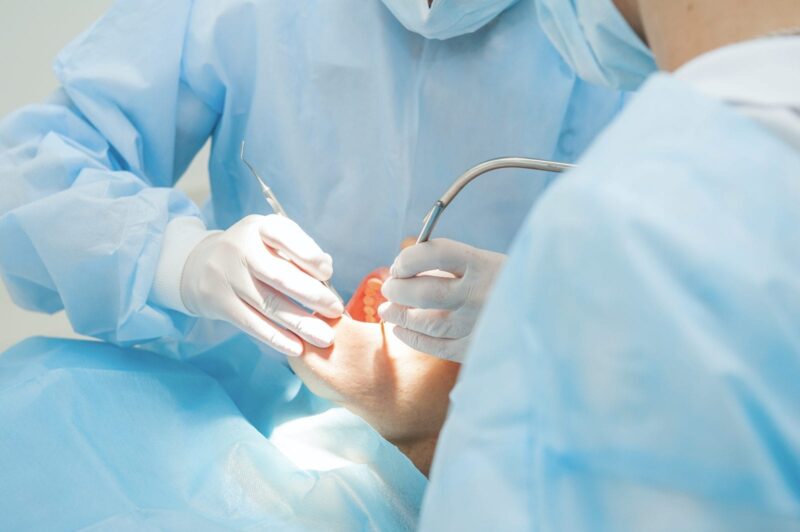 Dental surgeons performing an oral surgery