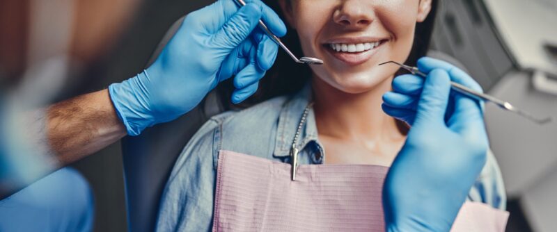 A woman receives dental treatment