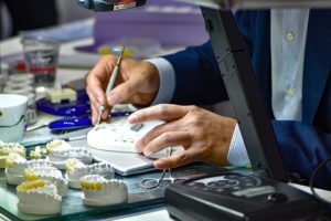 Technician creating dental crowns