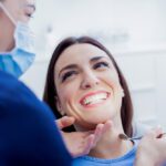 Patient getting teeth cleaned at dentist