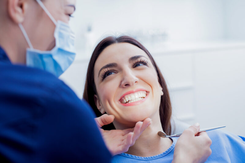 Patient getting teeth cleaned at dentist